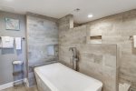 Enjoy MP313`s elegant en-suite deep soaking bath tub and walk in shower